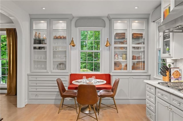 5545 Cross Gate Ct, Atlanta, GA 30327 - dining space featuring light wood finished floors and arched walkways