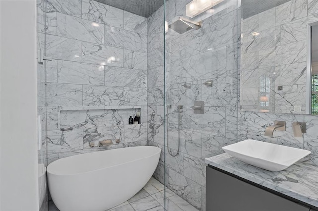 5545 Cross Gate Ct, Atlanta, GA 30327 - full bathroom featuring vanity, a soaking tub, marble tiled flooring, tile walls, and a walk in shower