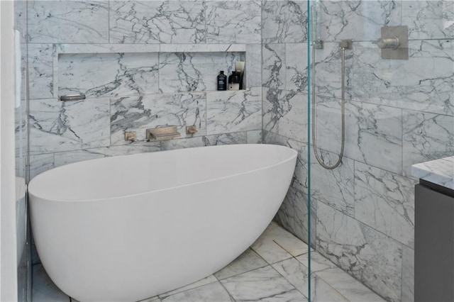 5545 Cross Gate Ct, Atlanta, GA 30327 - bathroom featuring a freestanding bath, tile walls, marble finish flooring, and vanity