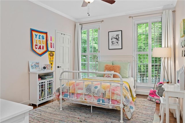 5545 Cross Gate Ct, Atlanta, GA 30327 - bedroom with wood finished floors, ornamental molding, and ceiling fan