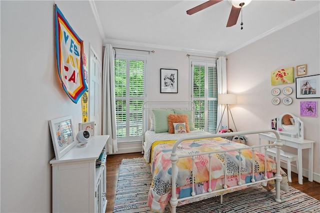 5545 Cross Gate Ct, Atlanta, GA 30327 - bedroom featuring wood finished floors, crown molding, a ceiling fan, and baseboards