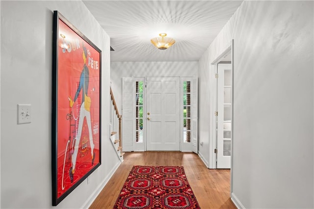 5545 Cross Gate Ct, Atlanta, GA 30327 - entryway featuring light wood-style floors, stairs, and baseboards