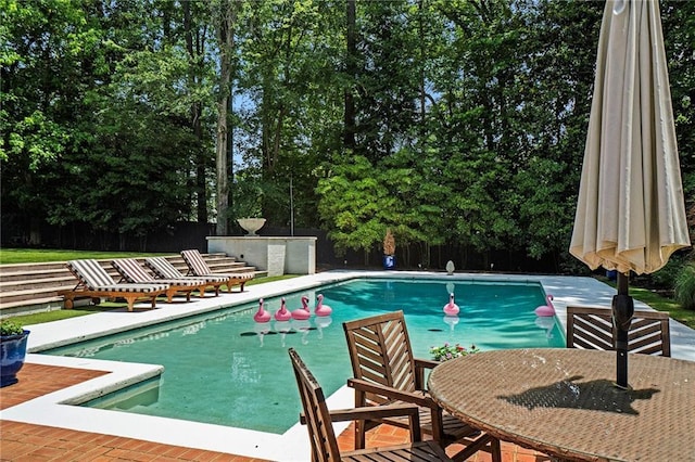 5545 Cross Gate Ct, Atlanta, GA 30327 - view of pool with view of scattered trees, a patio area, and outdoor dining space