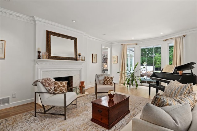 5545 Cross Gate Ct, Atlanta, GA 30327 - living room featuring ornamental molding, wood finished floors, baseboards, a premium fireplace, and recessed lighting