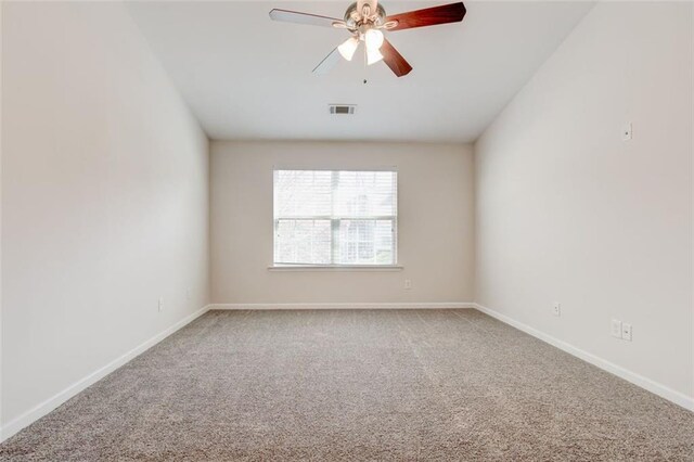 spare room with ceiling fan and carpet flooring