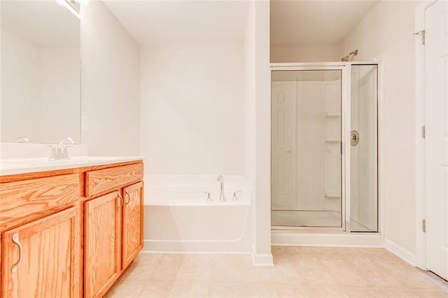 bathroom with vanity and separate shower and tub