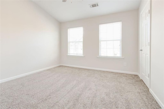 unfurnished room with vaulted ceiling, carpet flooring, and ceiling fan