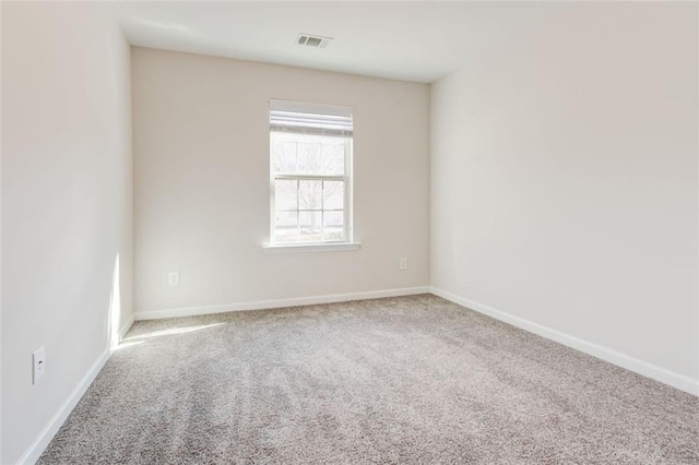 spare room featuring carpet