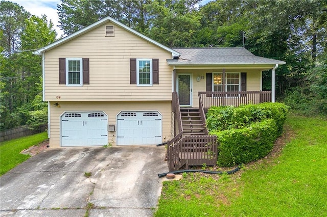 89 Cottonwood Loop, Dallas, GA 30132 - split level home with an attached garage, covered porch, stairway, driveway, and a front lawn