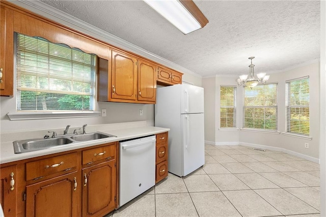 89 Cottonwood Loop, Dallas, GA 30132 - kitchen featuring white appliances, crown molding, brown cabinets, light countertops, and a chandelier