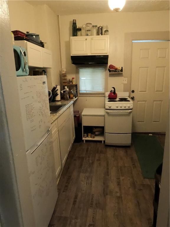 kitchen featuring white cabinetry, dark hardwood / wood-style flooring, white appliances, and light stone counters