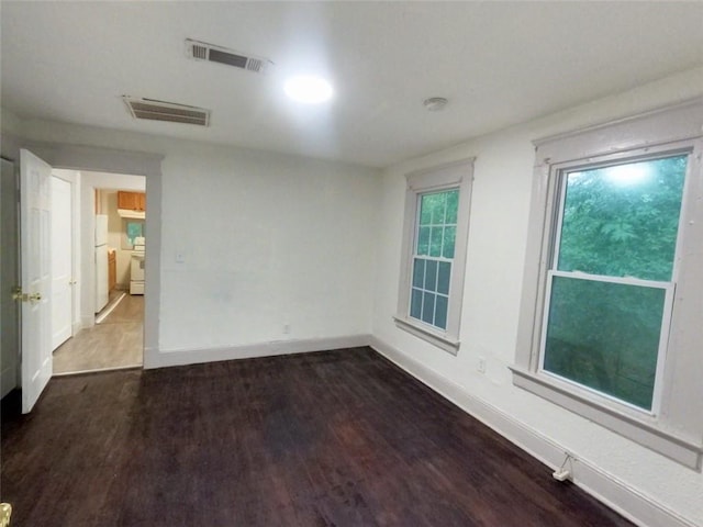 empty room featuring hardwood / wood-style flooring