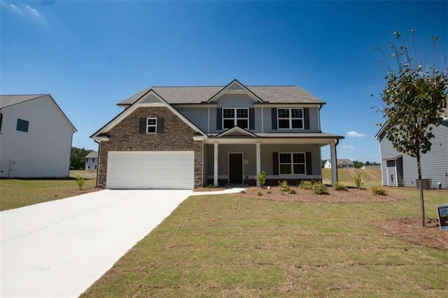 craftsman inspired home with a front lawn, covered porch, and a garage