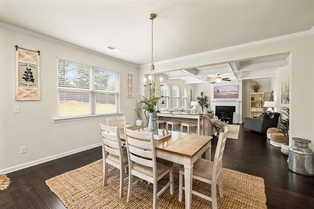 dining area with dark wood-type flooring, coffered ceiling, ceiling fan with notable chandelier, crown molding, and beam ceiling