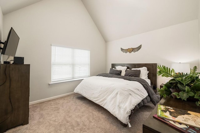 bedroom with light carpet and high vaulted ceiling