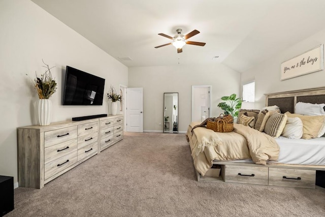 carpeted bedroom with vaulted ceiling and ceiling fan