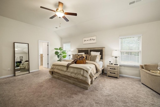 bedroom with light colored carpet, vaulted ceiling, and ceiling fan