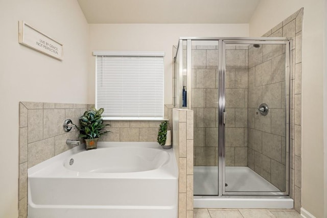 bathroom with tile patterned floors and plus walk in shower