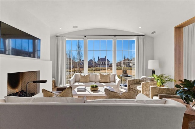 living room featuring vaulted ceiling