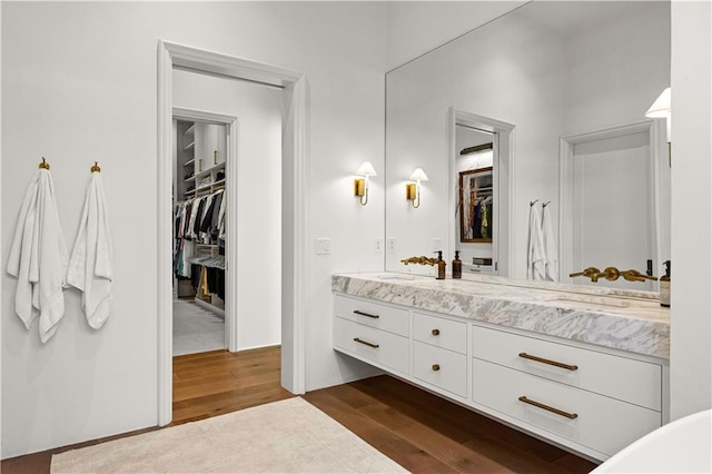 bathroom featuring hardwood / wood-style flooring and vanity