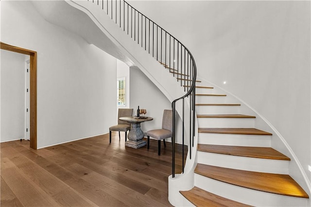 stairs with wood-type flooring