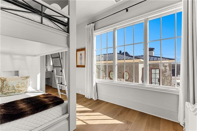 bedroom featuring wood-type flooring