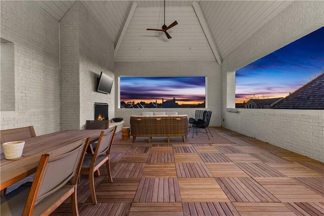 view of patio / terrace featuring an outdoor living space with a fireplace and ceiling fan