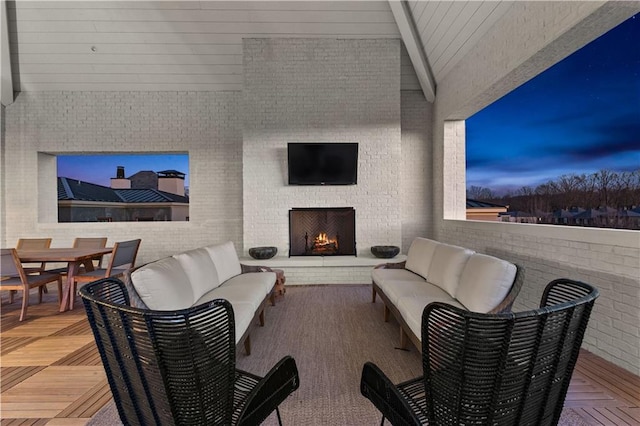 view of patio featuring an outdoor living space with a fireplace