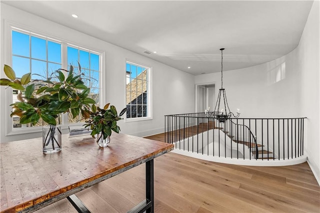 dining space featuring a chandelier and light wood-type flooring