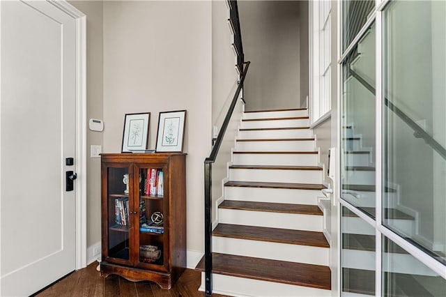 staircase featuring wood-type flooring