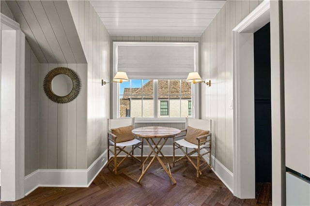 living area with dark parquet floors and breakfast area