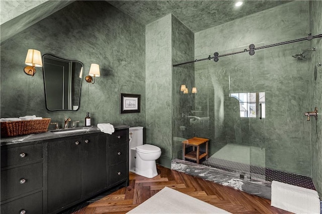 bathroom featuring toilet, parquet flooring, vanity, and tiled shower