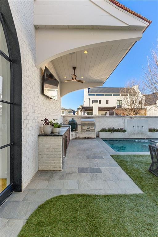 view of patio / terrace with ceiling fan, grilling area, and a fenced in pool