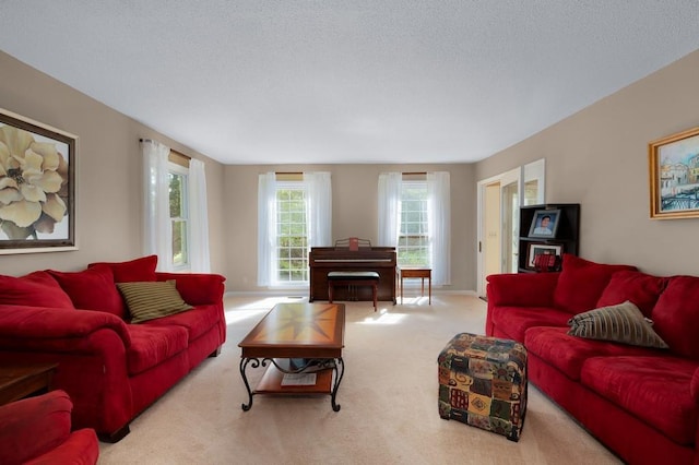 living room featuring light carpet and a textured ceiling