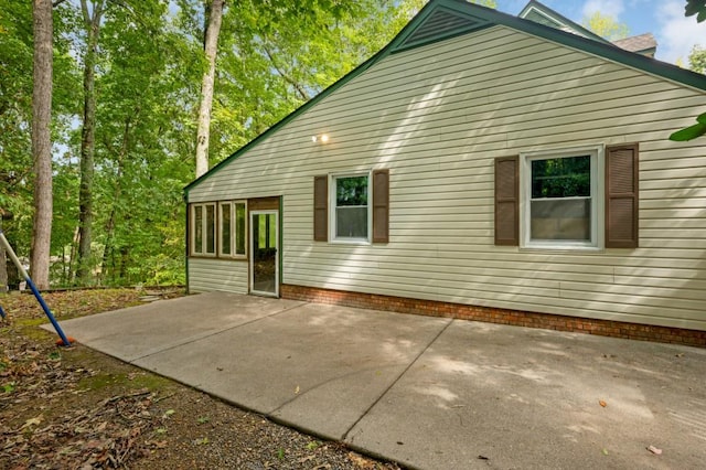 view of side of property featuring a patio area