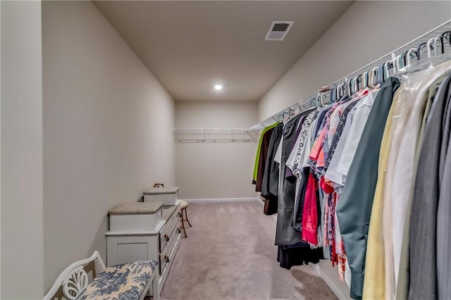 walk in closet with carpet floors and visible vents