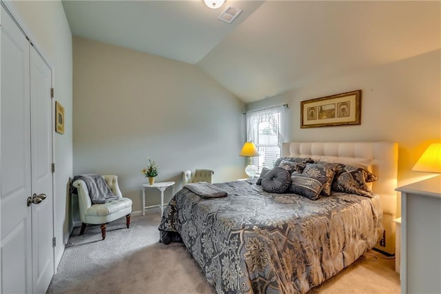 bedroom featuring light carpet, visible vents, and lofted ceiling