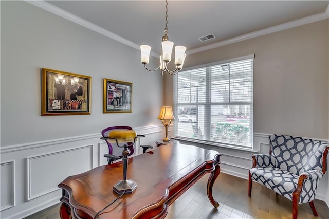 office area featuring a wainscoted wall, dark wood finished floors, visible vents, an inviting chandelier, and ornamental molding