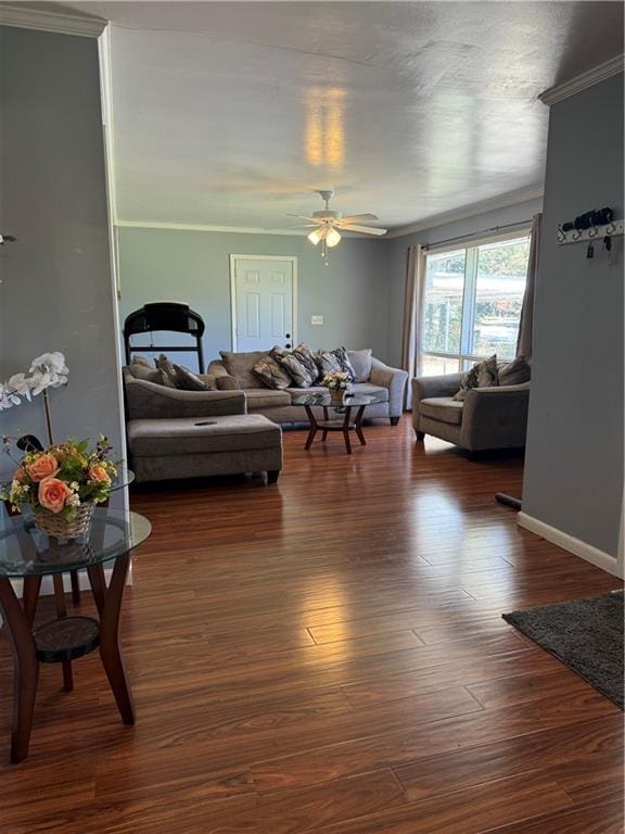 living room with ceiling fan, dark hardwood / wood-style flooring, and ornamental molding