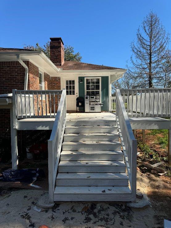 rear view of house with a deck