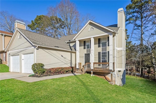 view of front of property with a garage and a front lawn