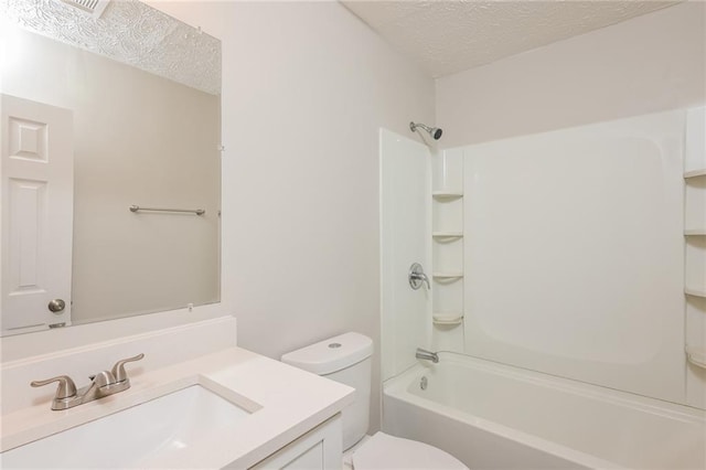 full bathroom featuring vanity, shower / tub combination, toilet, and a textured ceiling