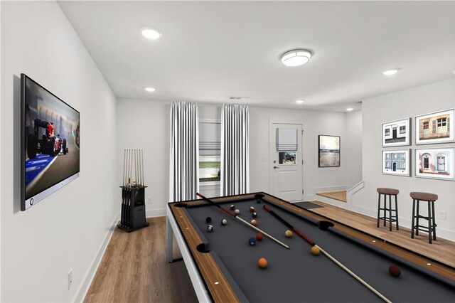 game room with wood-type flooring and billiards