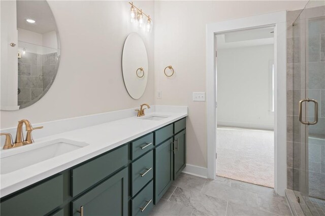 bathroom featuring vanity and a shower with door