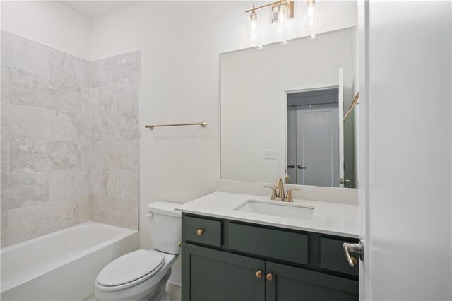 full bathroom with vanity, toilet, and tiled shower / bath combo