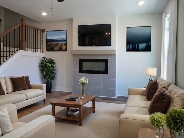 living room featuring hardwood / wood-style flooring and a fireplace