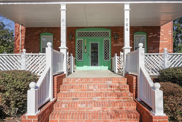 property entrance featuring covered porch