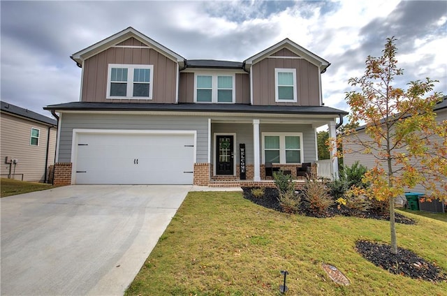 craftsman inspired home with covered porch, a garage, and a front lawn