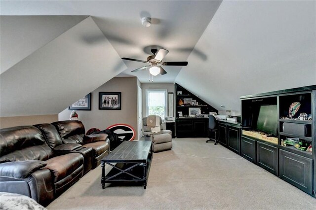 living room featuring lofted ceiling, light carpet, and ceiling fan