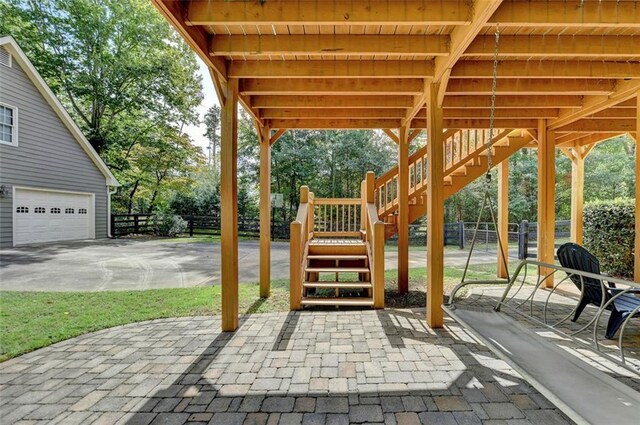 view of patio featuring a garage